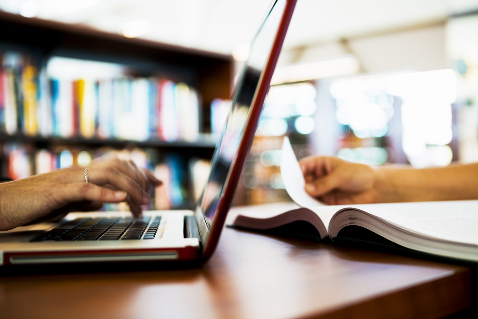 an image of laptop computer and open book