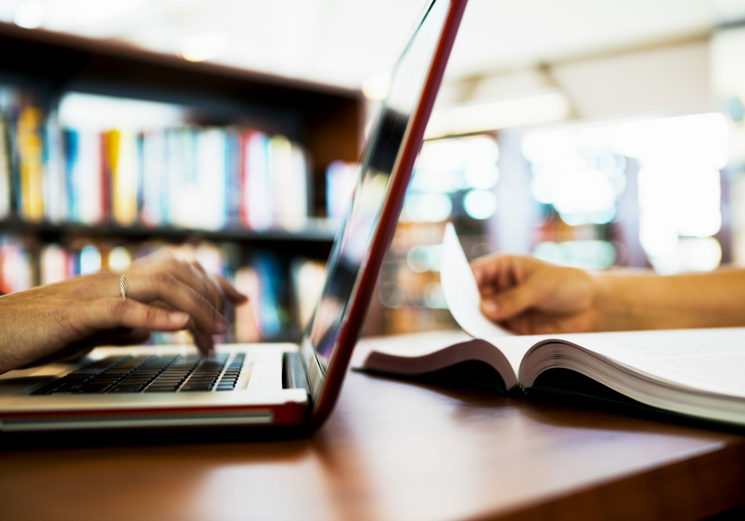 an image of laptop computer and open book